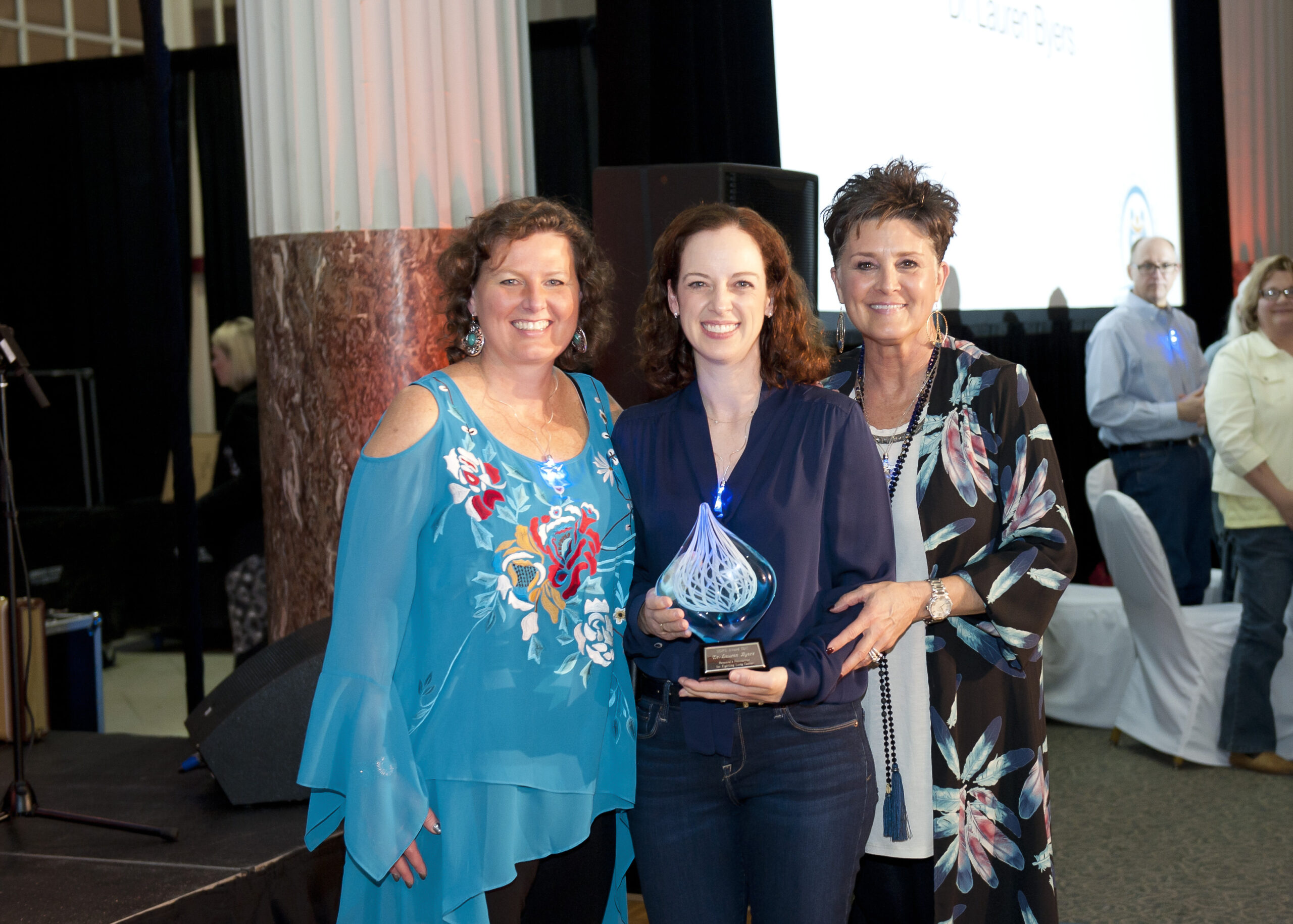 Image of Pictured left to right: Lisa Spain (Executive Director), Dr. Lauren Byers (M.D. Anderson), Sandy Sledge (Board Member)